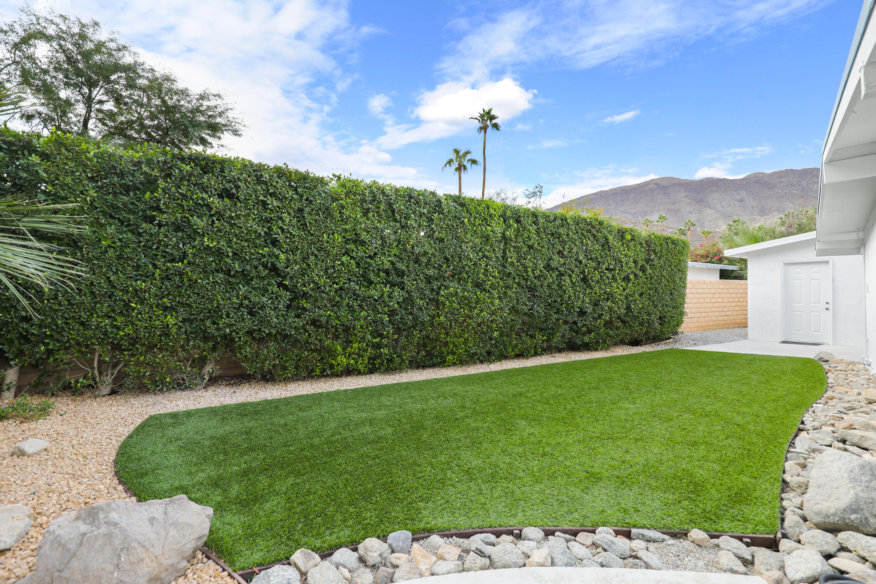 71828 San Gorgonio Road Rancho Mirage, CA 92270 - Photo 25 of 32 a view of a backyard with a garden