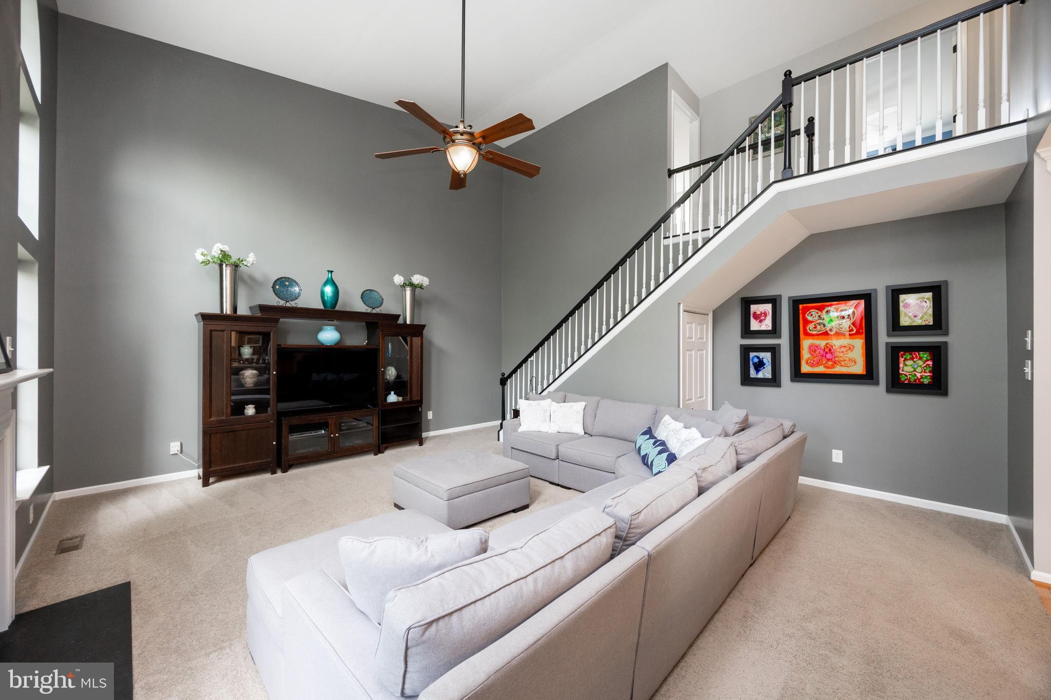 113 Blue Ribbon Way Downingtown, PA 19335 - Photo 15 of 50 a living room with furniture and a fireplace