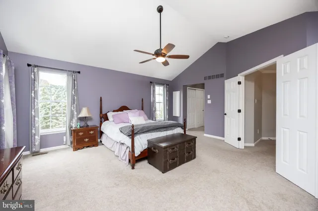 a bathroom with a bathtub a mirror a double vanity sinks and vanity