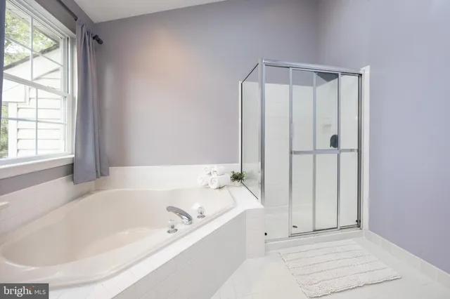 a bed room with furniture and a window