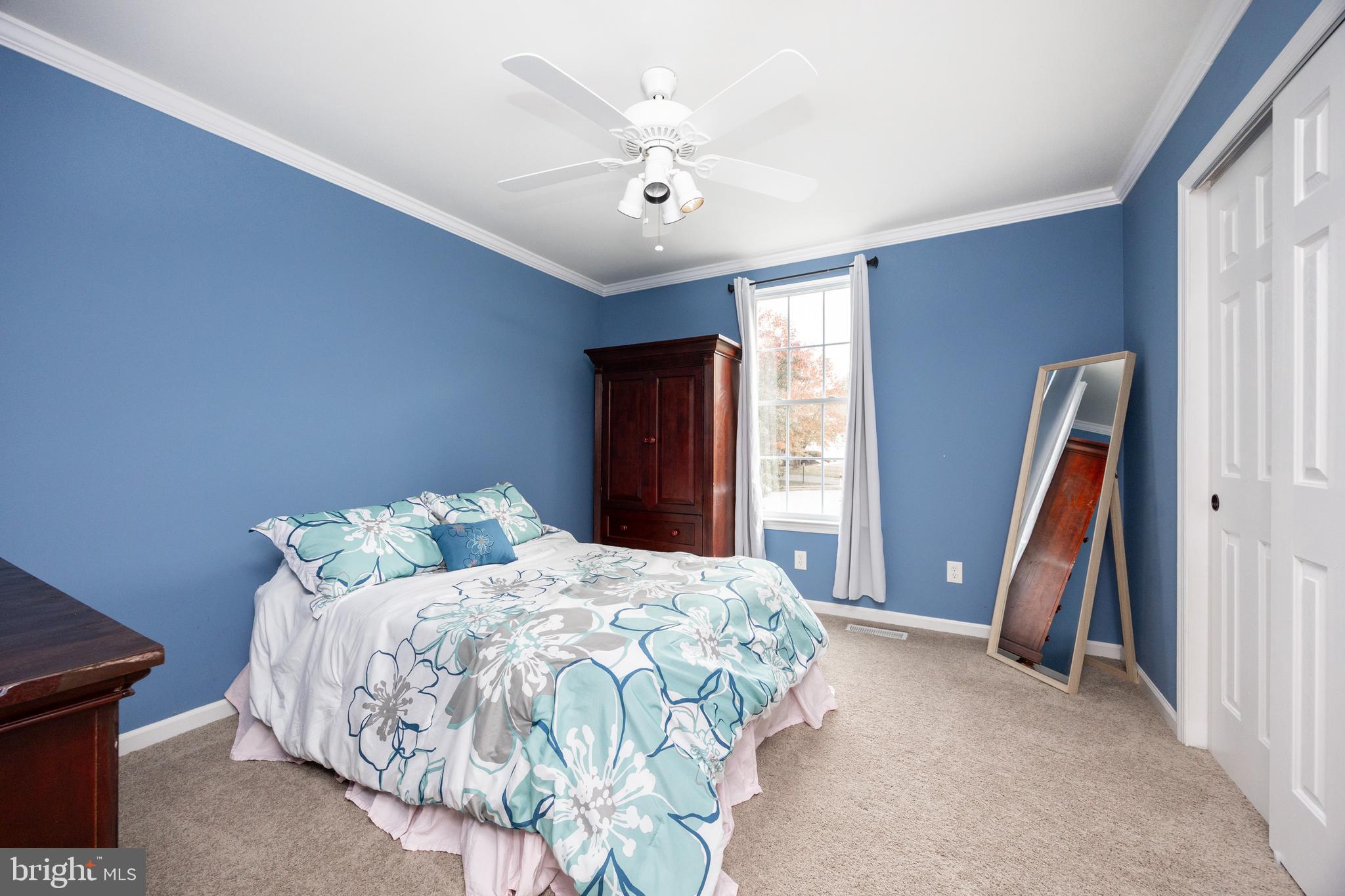 113 Blue Ribbon Way Downingtown, PA 19335 - Photo 28 of 50 a bedroom with a bed and a large window