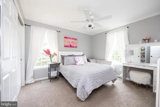 a bathroom with a double vanity sink toilet and shower