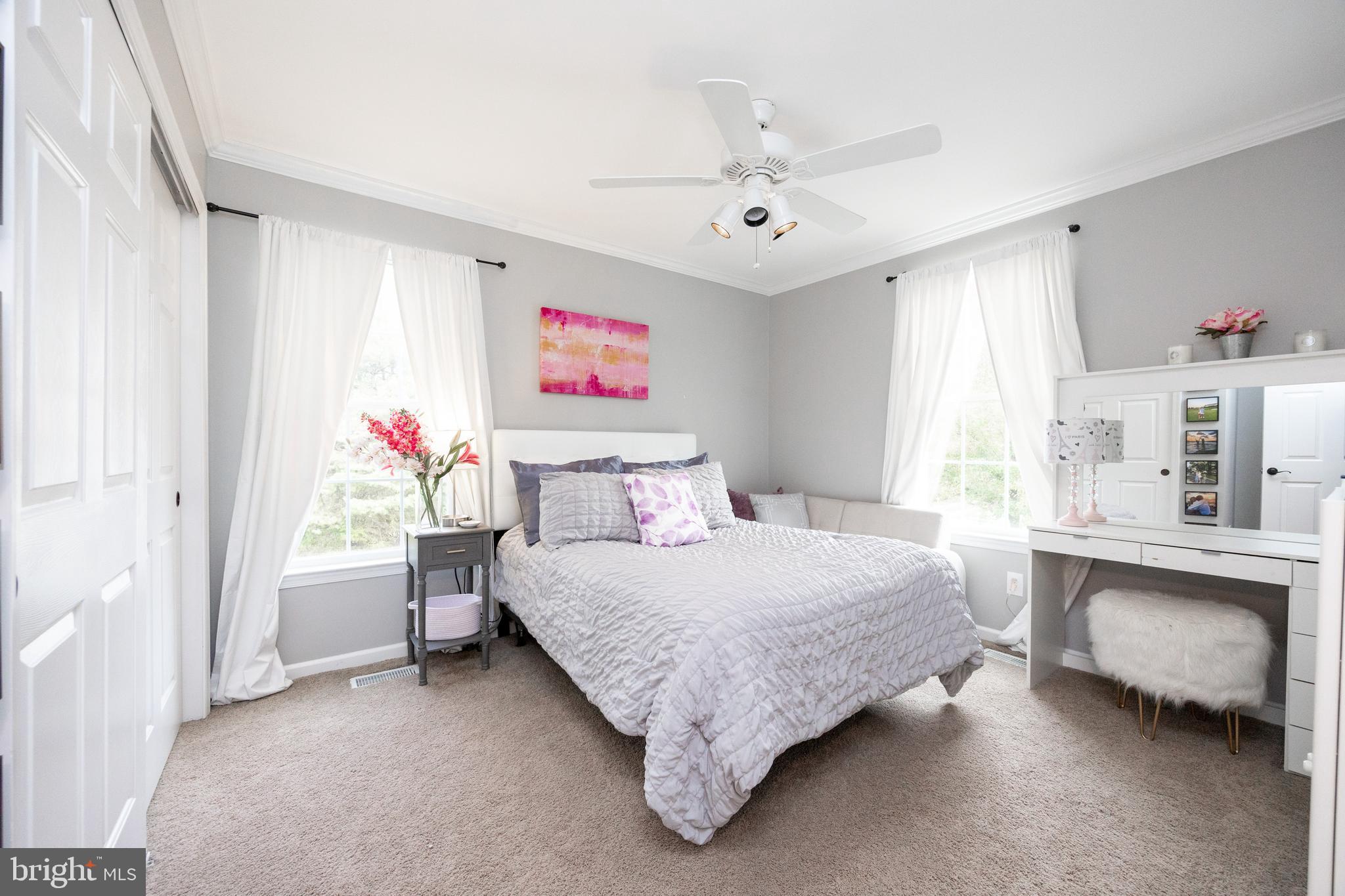 113 Blue Ribbon Way Downingtown, PA 19335 - Photo 29 of 50 a bedroom with a bed and a chandelier