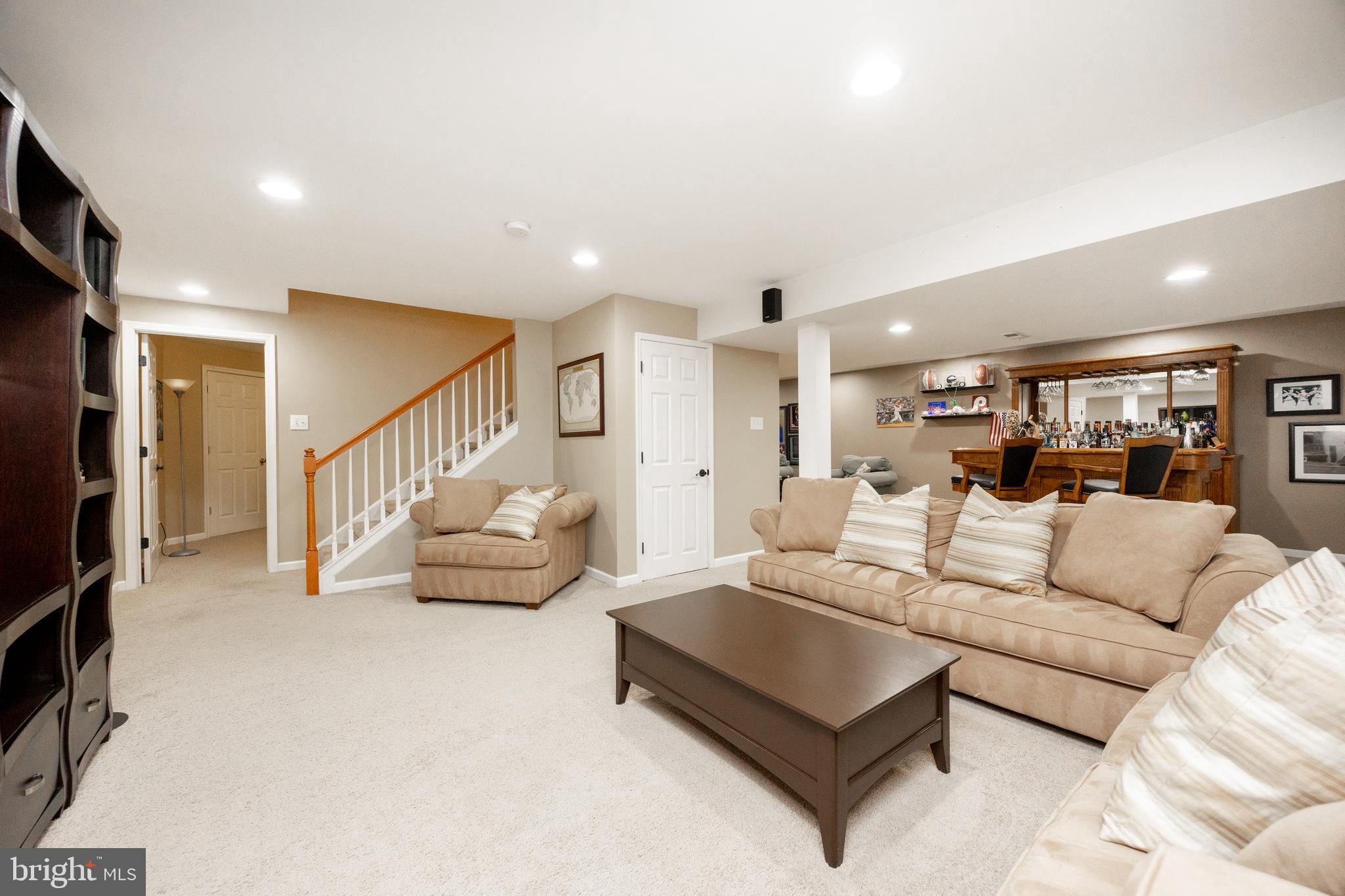 113 Blue Ribbon Way Downingtown, PA 19335 - Photo 32 of 50 a living room with furniture and a wooden floor