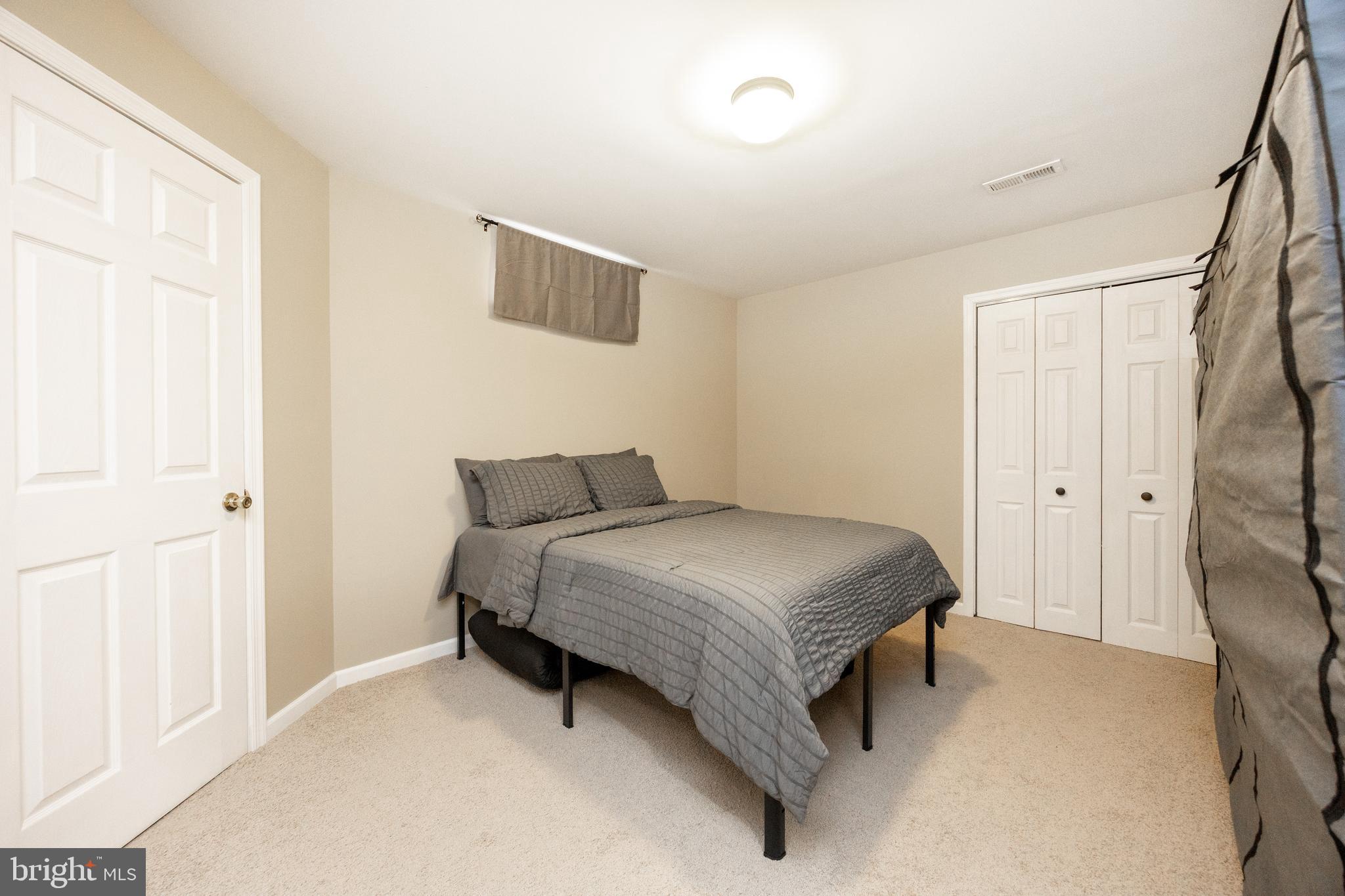 113 Blue Ribbon Way Downingtown, PA 19335 - Photo 38 of 50 a spacious bedroom with a bed and a window