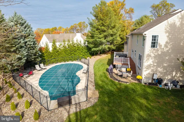 a balcony with wooden floor and furniture