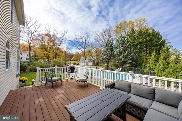 a house view with swimming pool and furniture