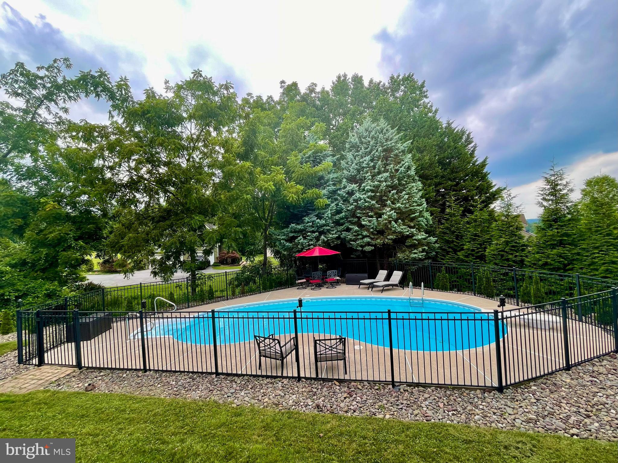 113 Blue Ribbon Way Downingtown, PA 19335 - Photo 45 of 50 a green field with trees in the background