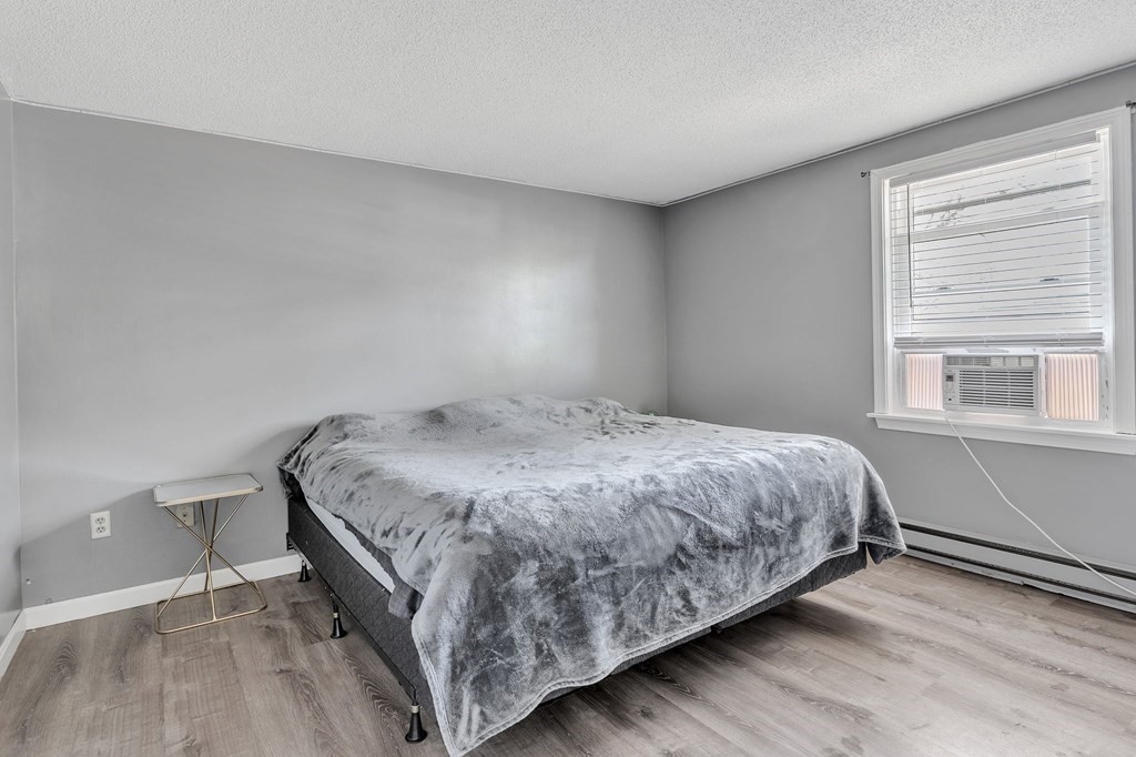 242 Gilbert Avenue Springfield, MA 01119 - Photo 32 of 38 a bedroom with a bed and window
