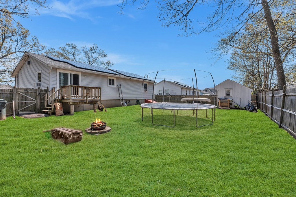 242 Gilbert Avenue Springfield, MA 01119 - Photo 5 of 38 a backyard of a house with table and chairs