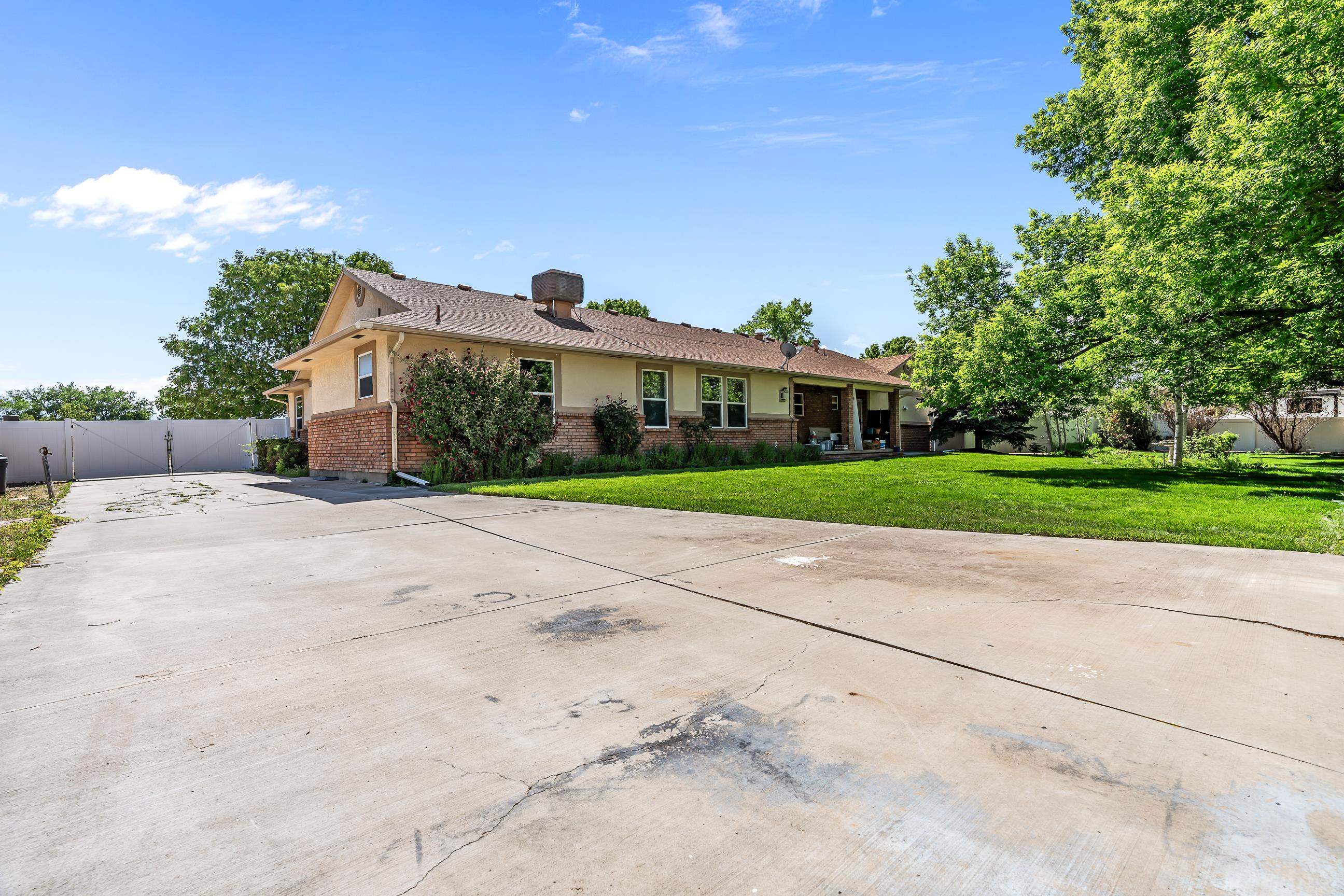705-24 24 3/4 Road Grand Junction, CO 81505 - Photo 23 of 27 a view of a house with a yard