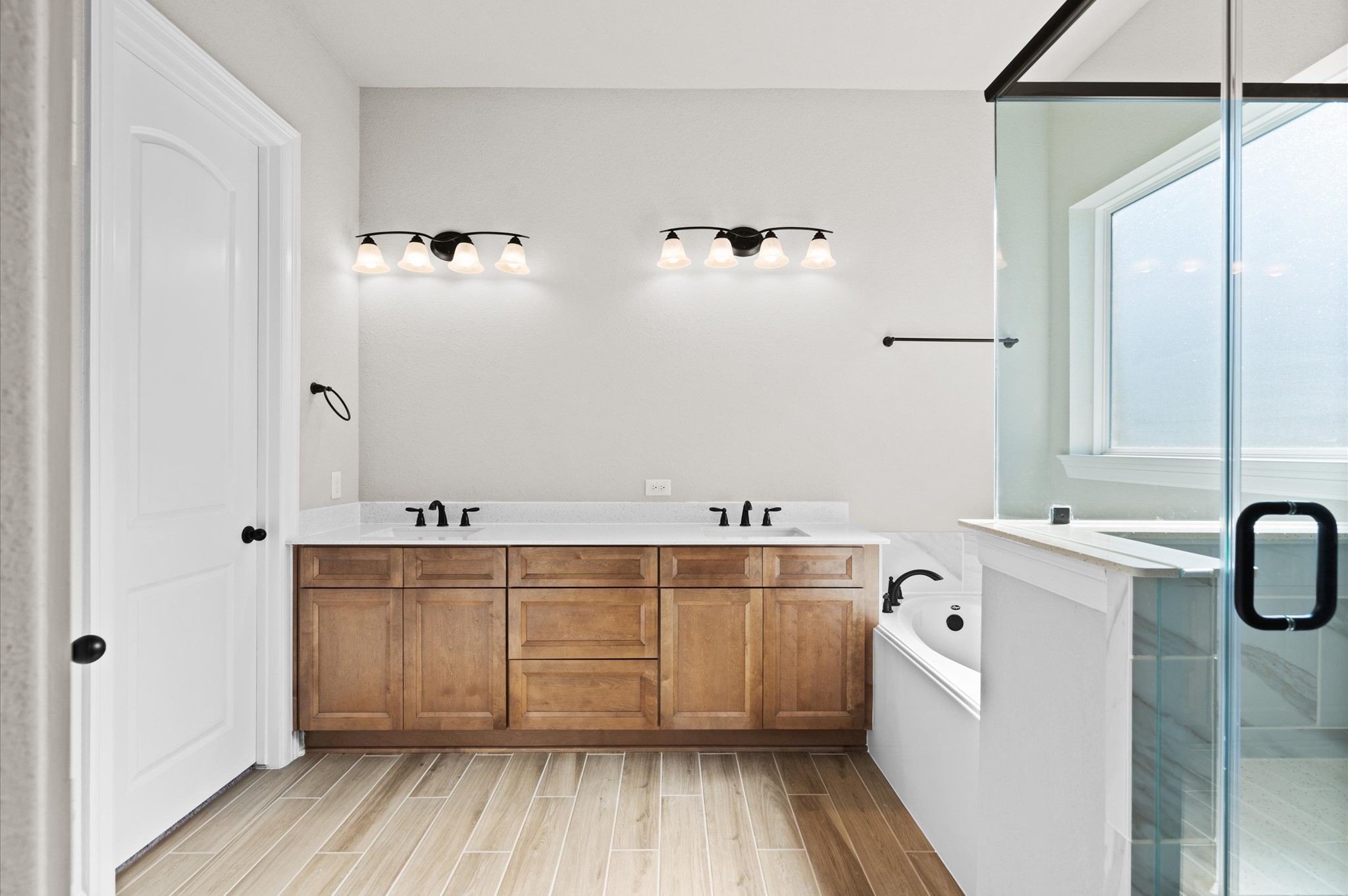 1225 Friendship Trail Seabrook, TX 77586 - Photo 12 of 22 a view of a bathroom with a tub shower and sink