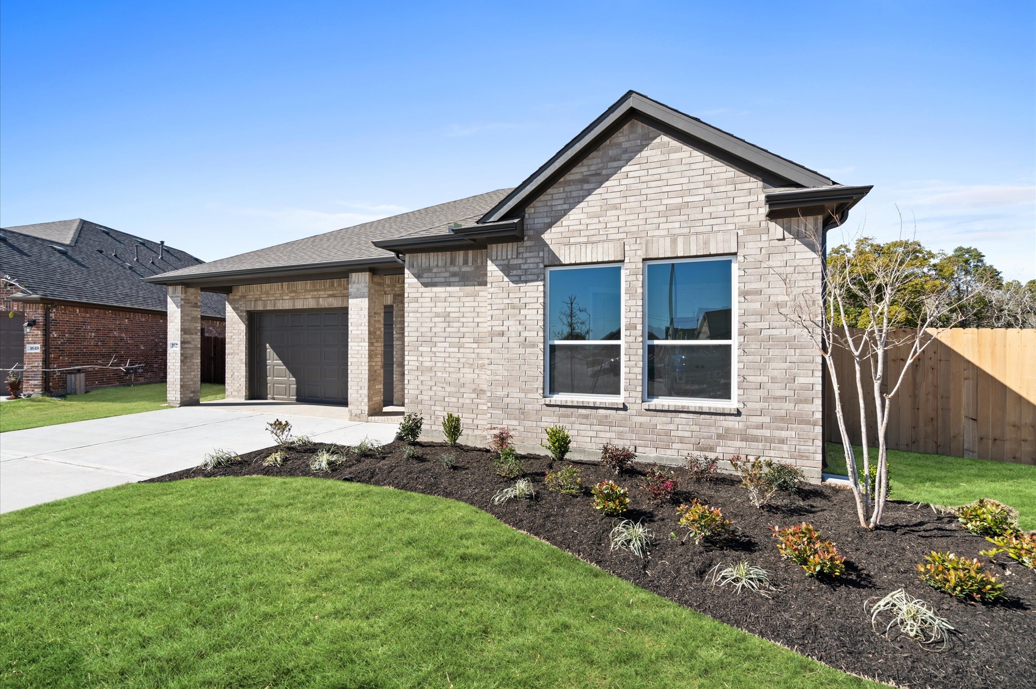 1225 Friendship Trail Seabrook, TX 77586 - Photo 21 of 22 a front view of house with yard and outdoor seating