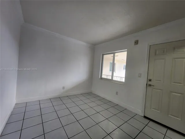 a view of an empty room and window