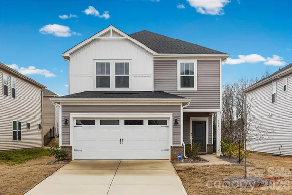 a front view of a house with a garage