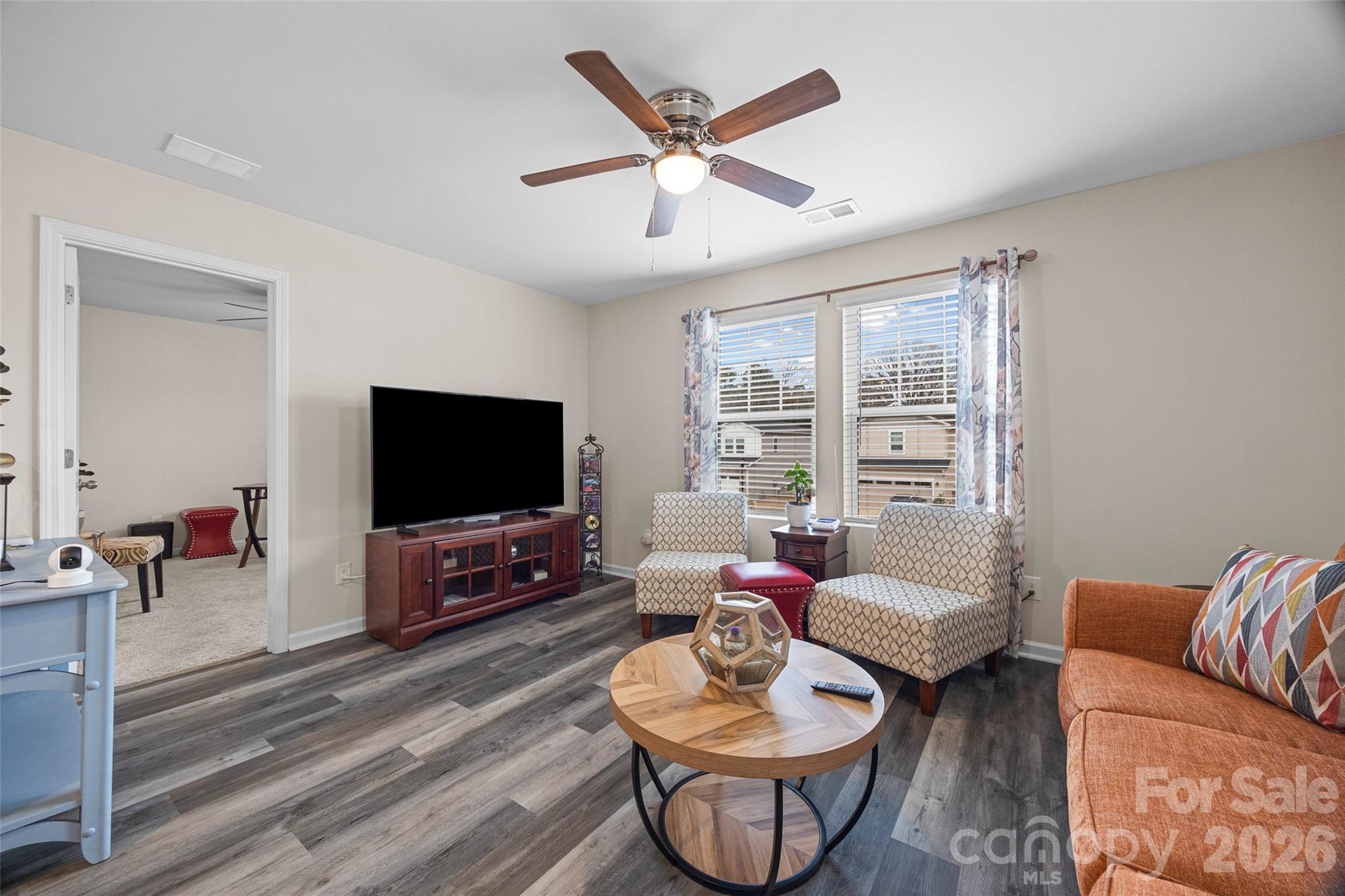 359 Olympia Way York, SC 29745 - Photo 14 of 27 a living room with furniture a flat screen tv and a large window