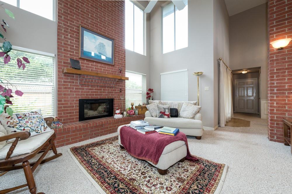 9554 David Fort Road Argyle, TX 76226 - Photo 18 of 35 a living room with furniture and a fireplace