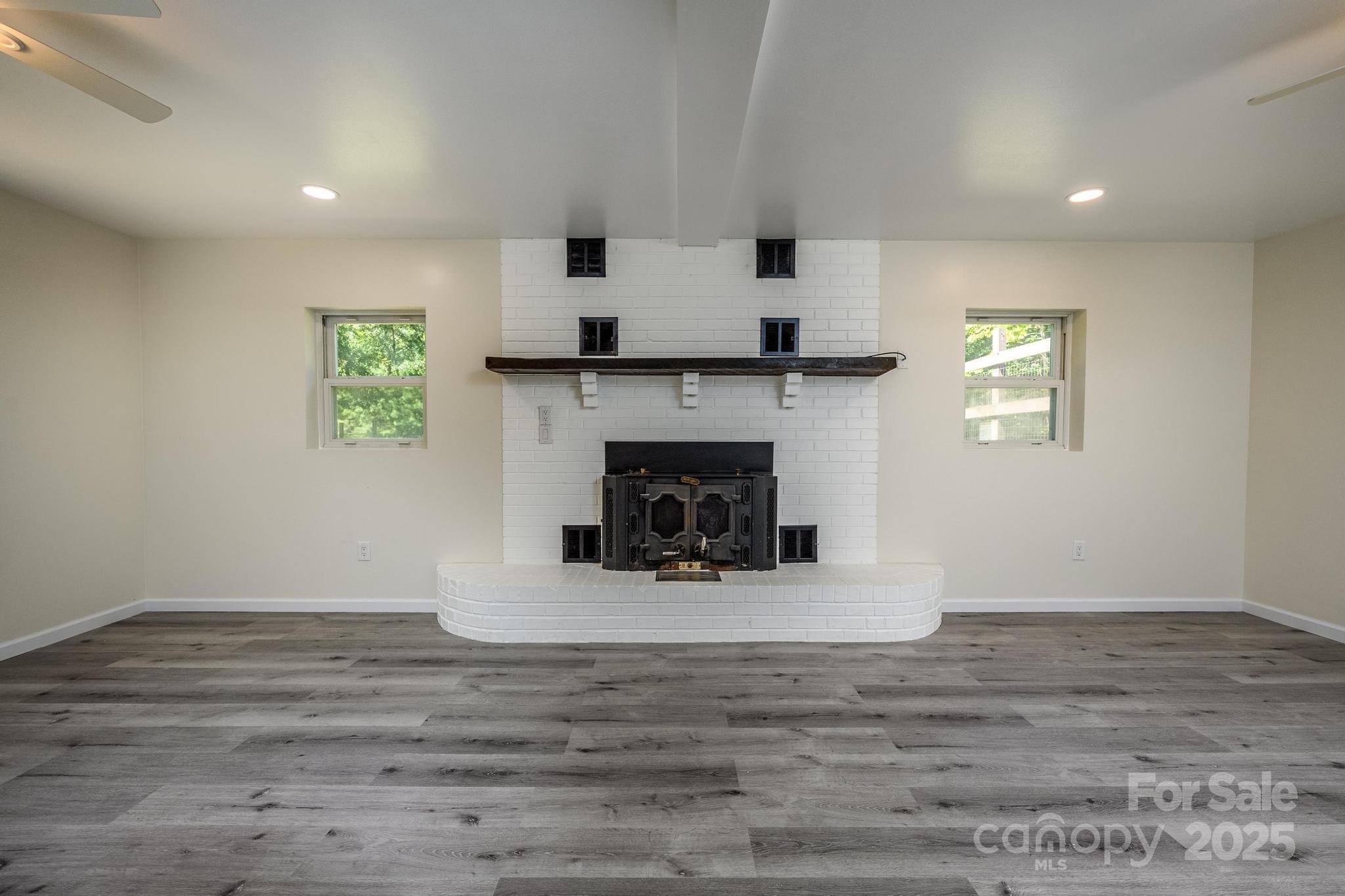 160 Clairmont Road Salisbury, NC 28146 - Photo 25 of 42 a living room with furniture and a fireplace