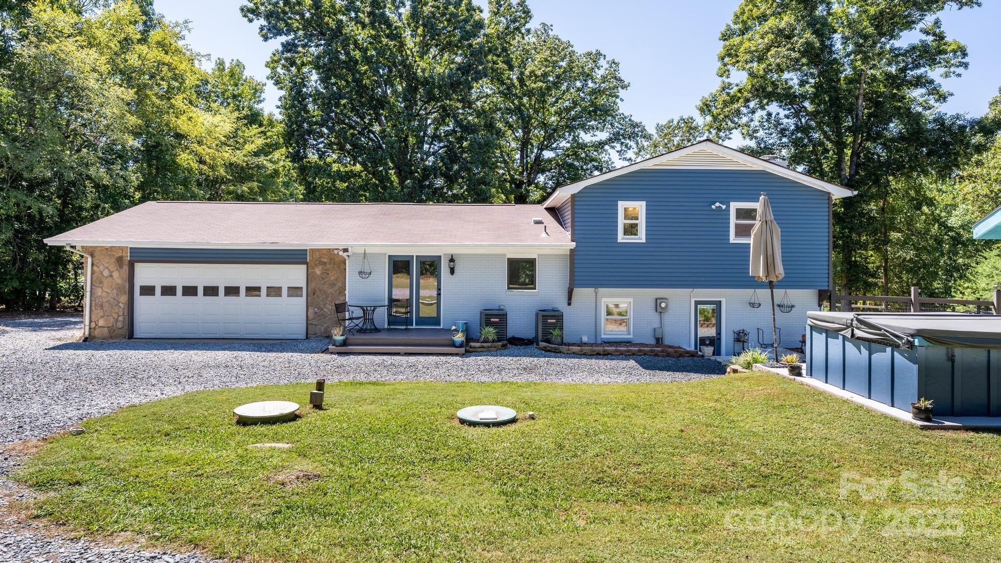 160 Clairmont Road Salisbury, NC 28146 - Photo 35 of 42 a view of a house with swimming pool and sitting area