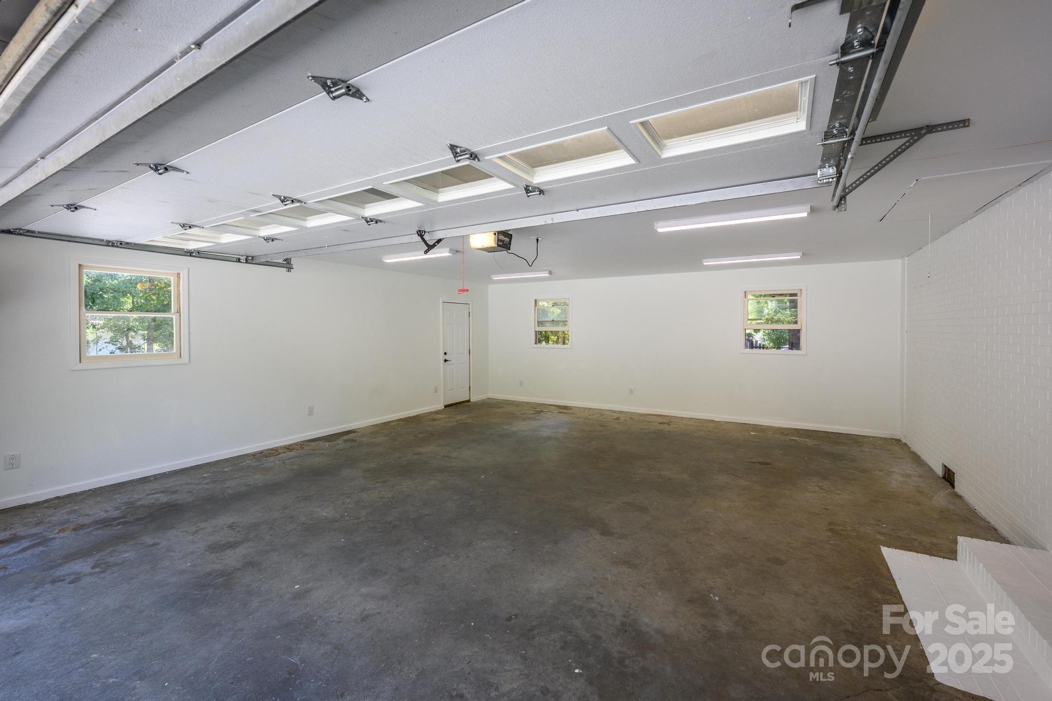 160 Clairmont Road Salisbury, NC 28146 - Photo 36 of 42 a view of a big room with wooden floor and windows