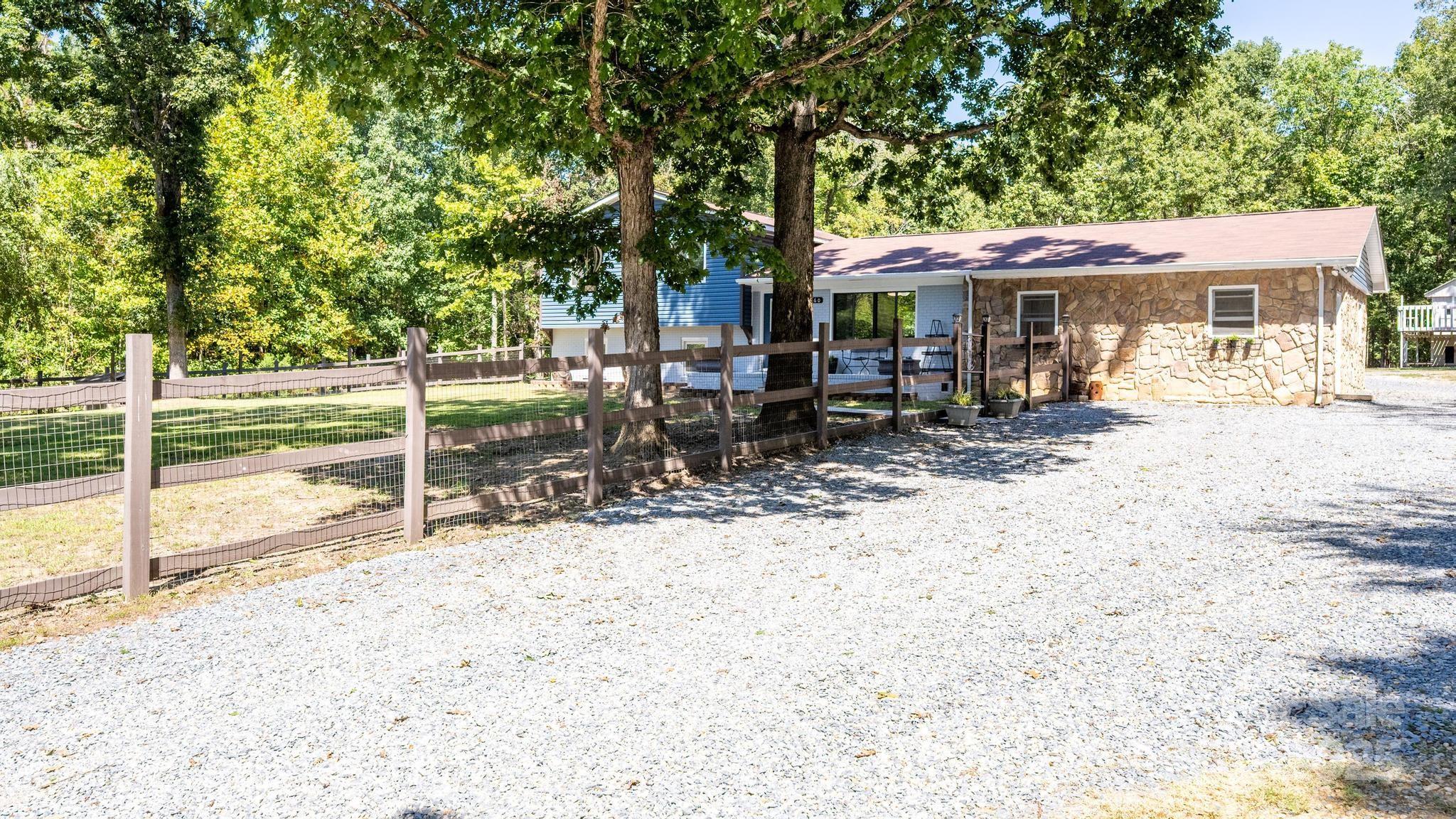 160 Clairmont Road Salisbury, NC 28146 - Photo 6 of 42 a view of a house with a patio and a backyard