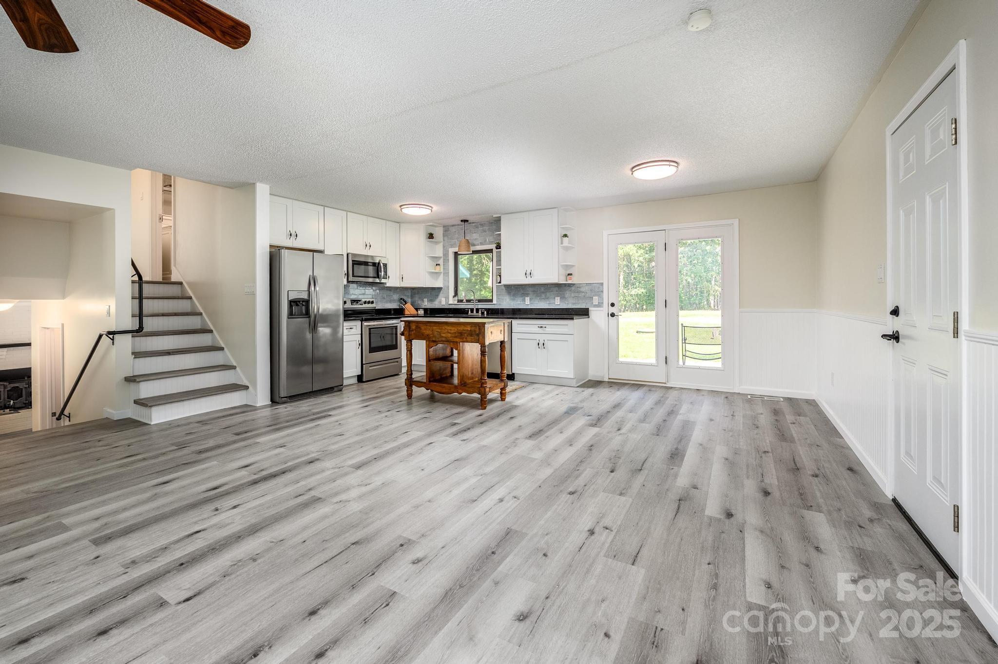 160 Clairmont Road Salisbury, NC 28146 - Photo 9 of 42 a view of a kitchen with wooden floor and electronic appliances