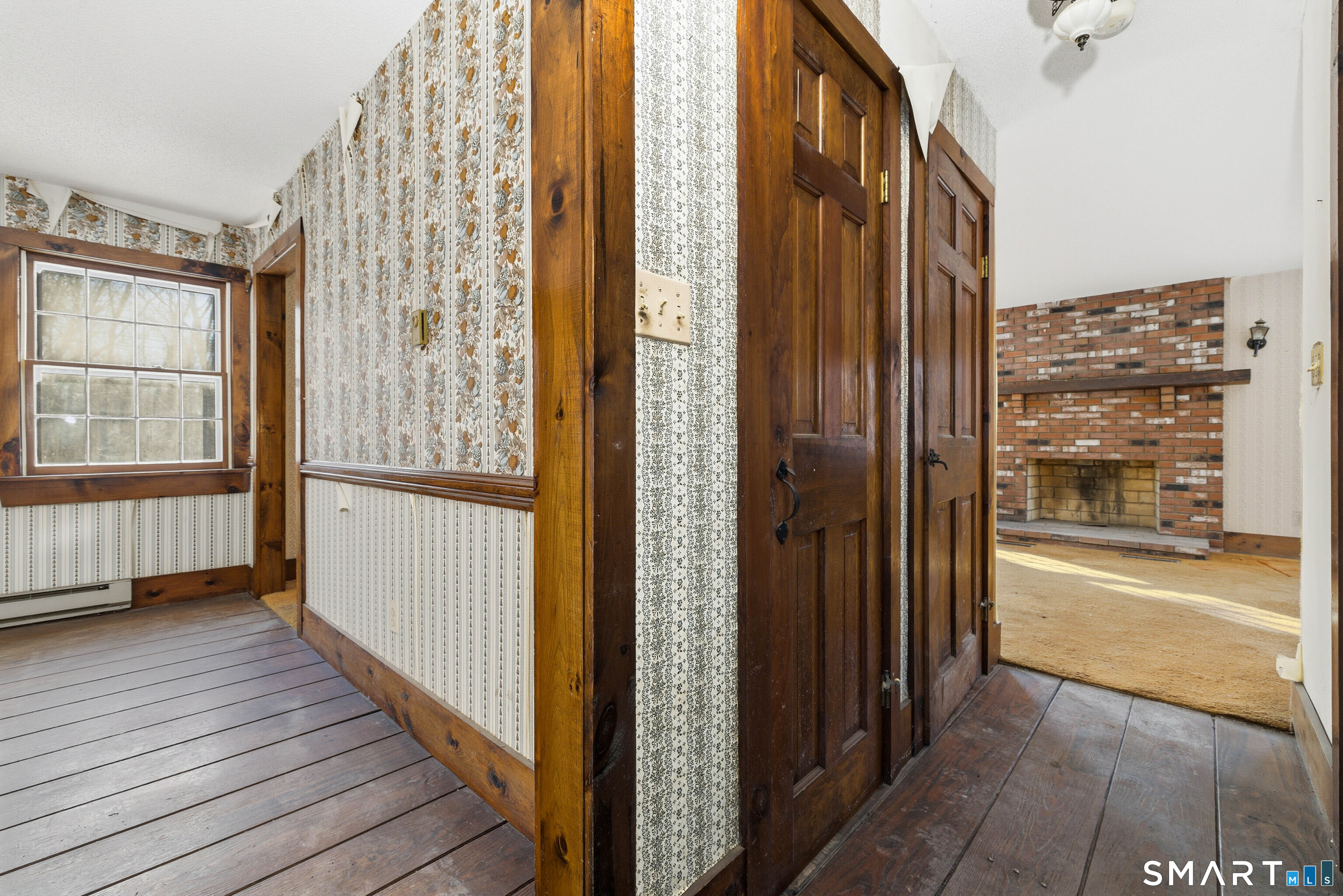 115 Melrose Road East Windsor, CT 06016 - Photo 16 of 28 a view of a large room with wooden floor and windows