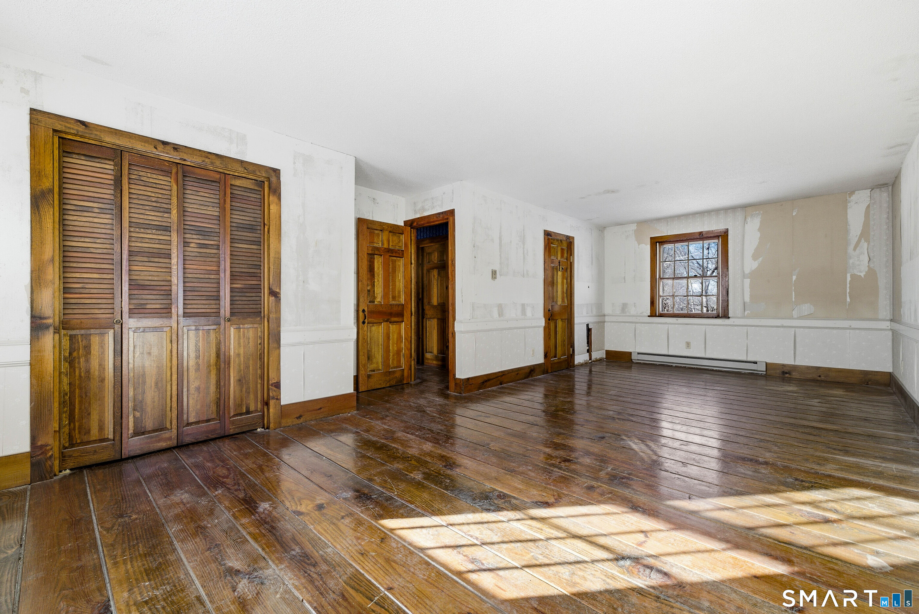 115 Melrose Road East Windsor, CT 06016 - Photo 20 of 28 a view of a livingroom with wooden floor and window