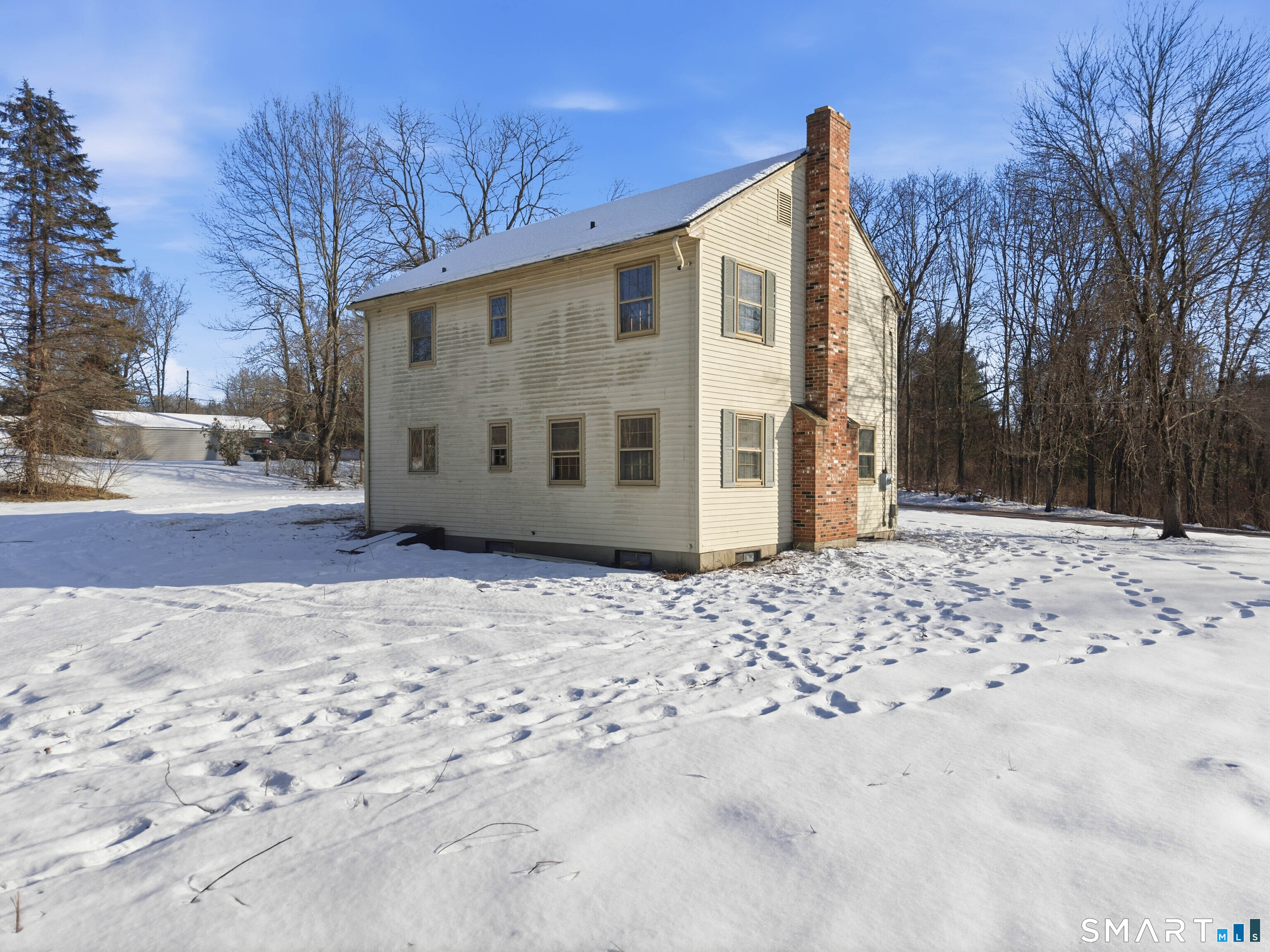 115 Melrose Road East Windsor, CT 06016 - Photo 2 of 28 a view of a white house with a yard covered in snow