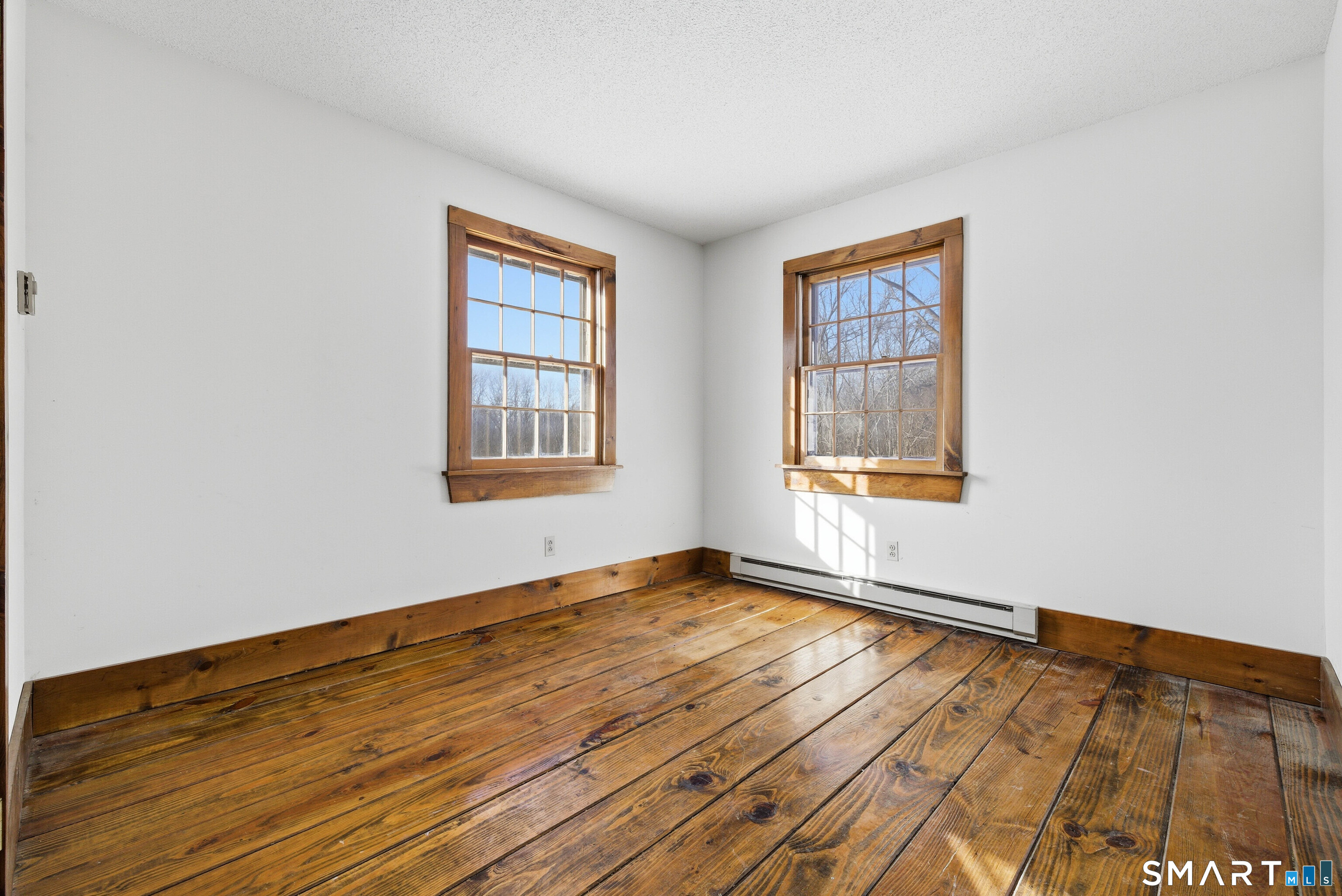 115 Melrose Road East Windsor, CT 06016 - Photo 21 of 28 a view of an empty room with wooden floor and a window