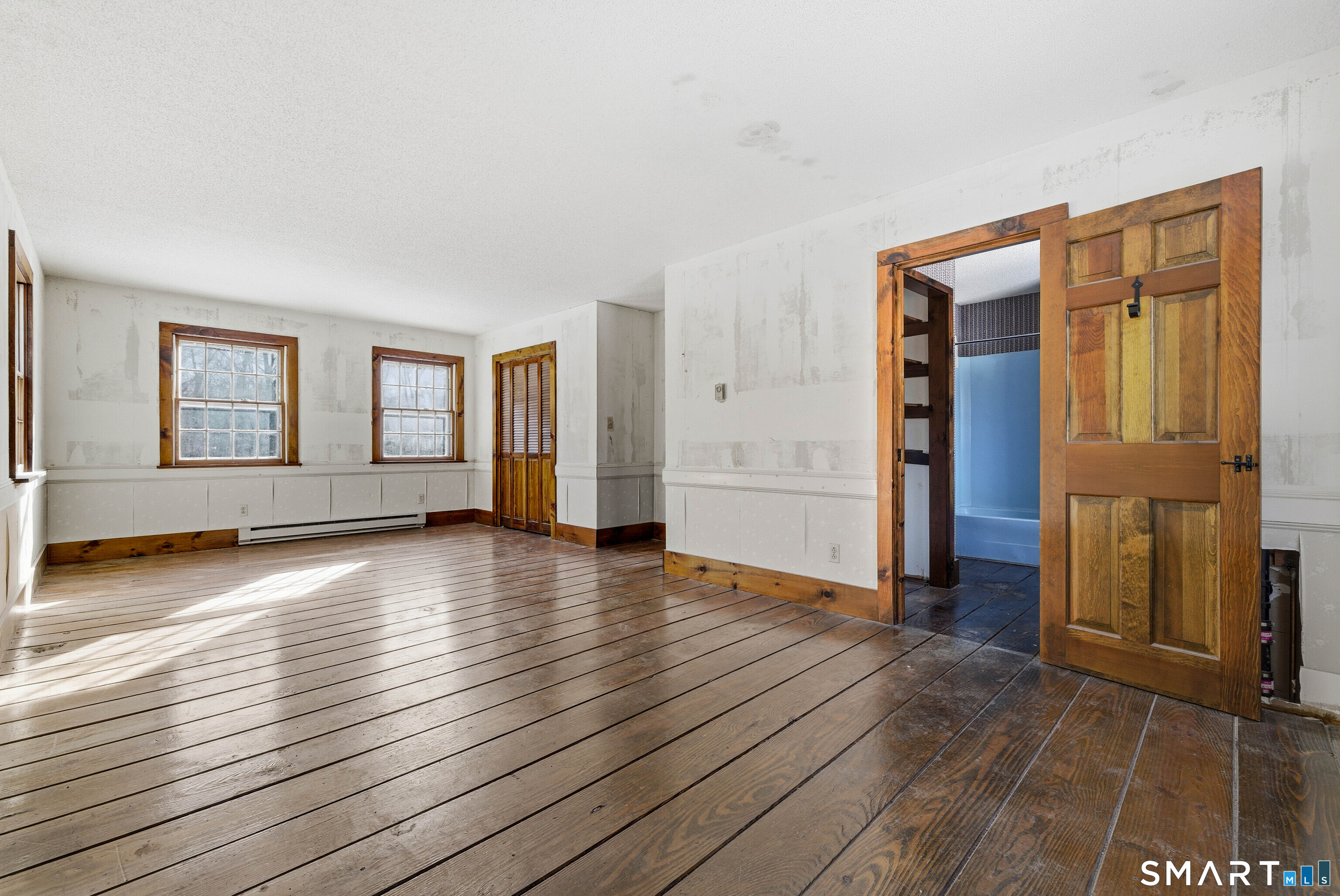 115 Melrose Road East Windsor, CT 06016 - Photo 23 of 28 an empty room with wooden floor and windows