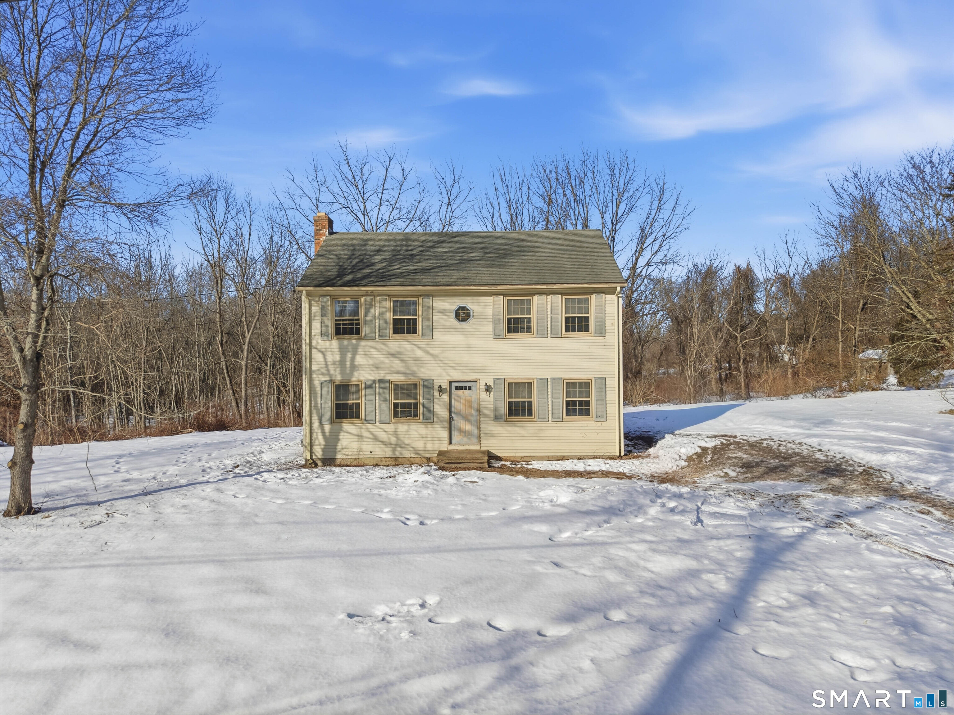115 Melrose Road East Windsor, CT 06016 - Photo 3 of 28 a view of a house with a yard covered in snow