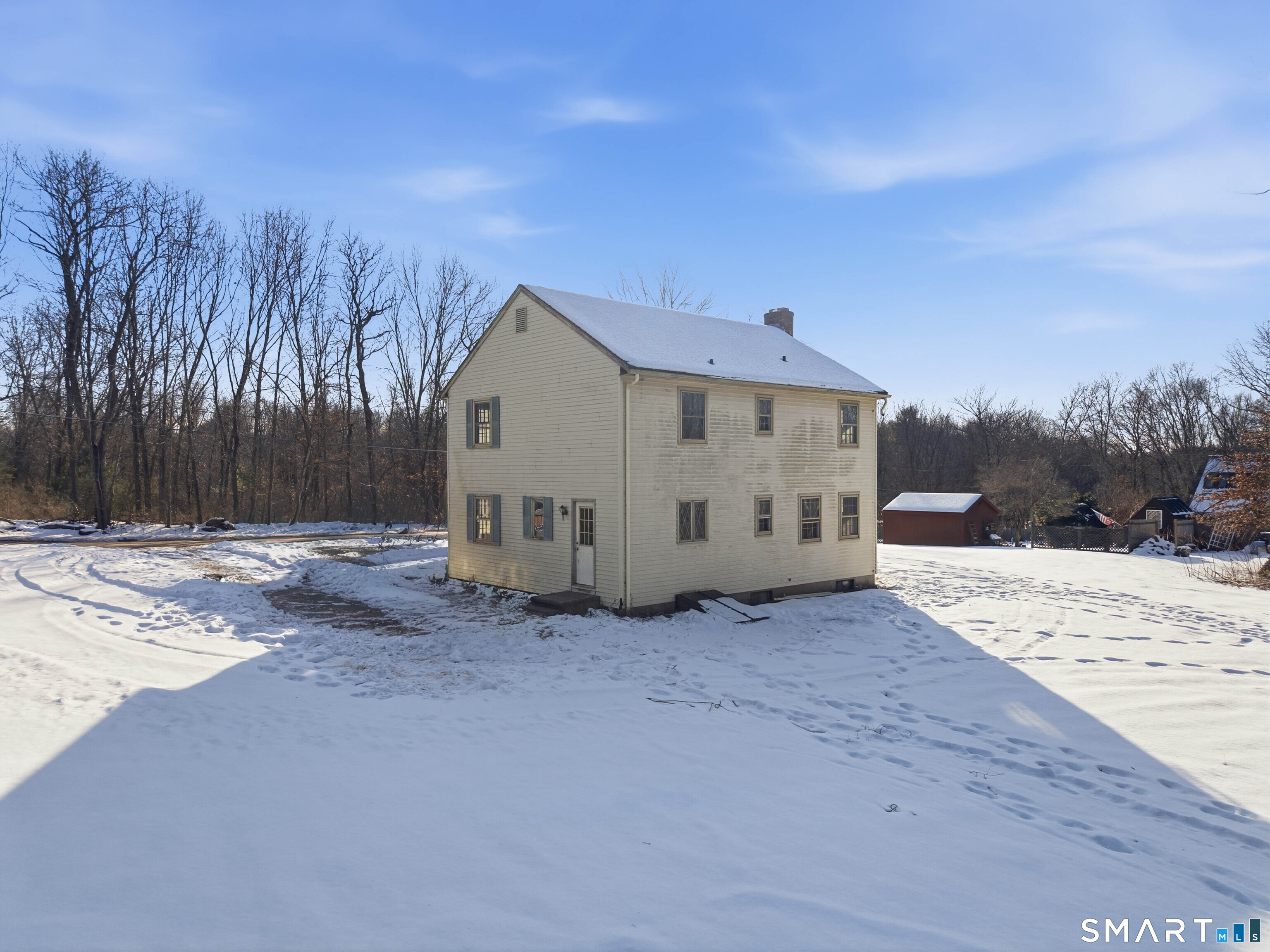 115 Melrose Road East Windsor, CT 06016 - Photo 4 of 28 a view of a dry yard with a house