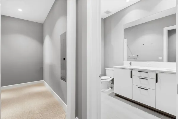 an empty room with a bathroom