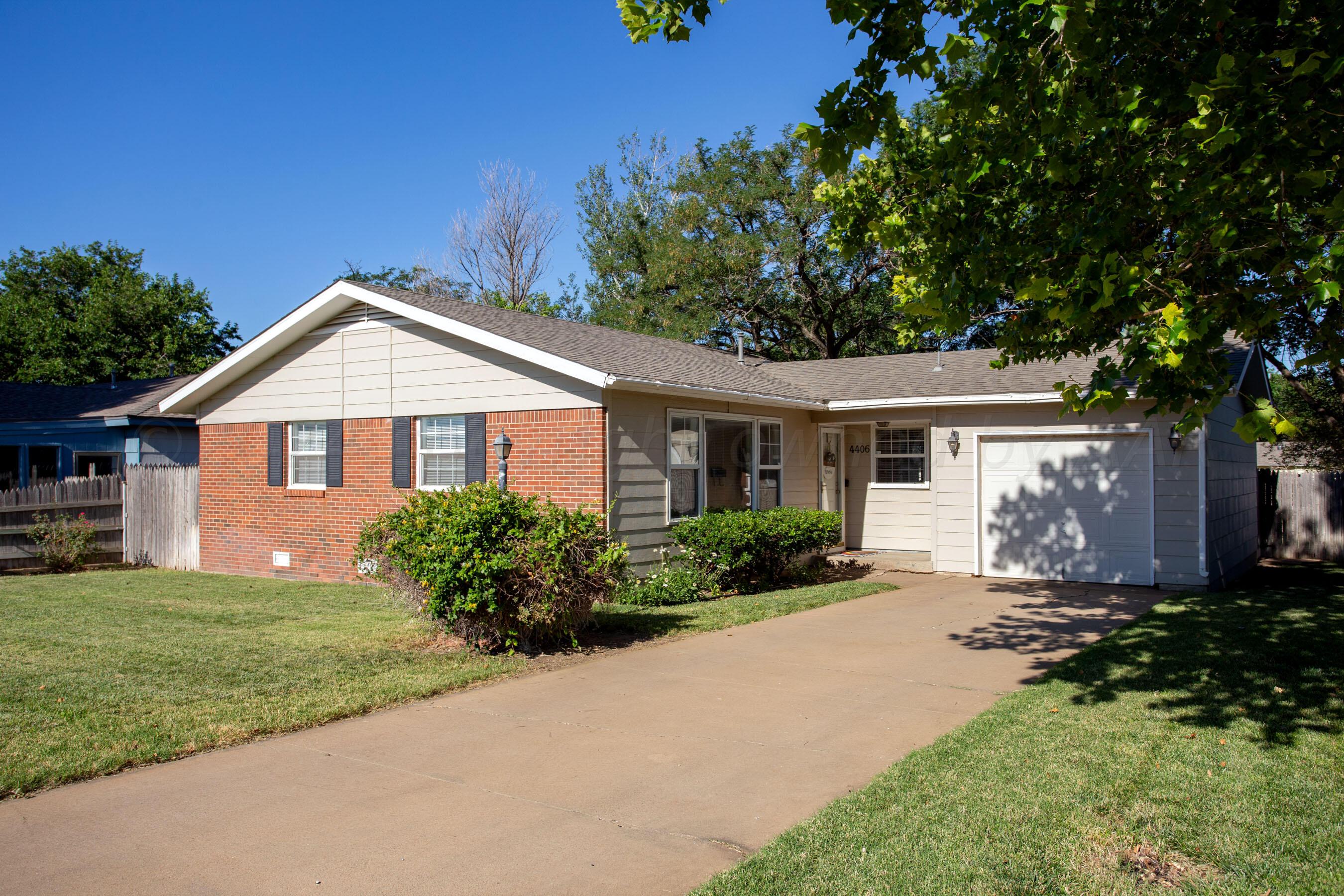 4406 South Bonham Street Amarillo, TX 79110 - Photo 2 of 26 a front view of a house with a yard