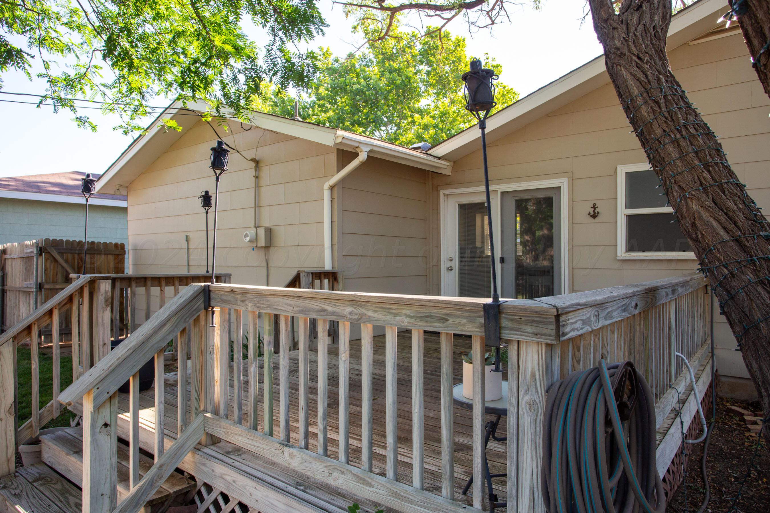 4406 South Bonham Street Amarillo, TX 79110 - Photo 21 of 26 a view of a house with wooden deck front of house