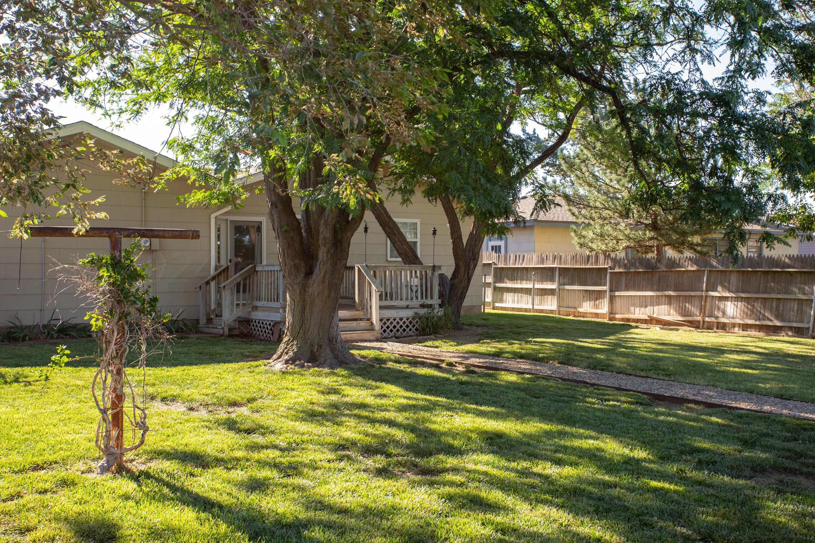 4406 South Bonham Street Amarillo, TX 79110 - Photo 25 of 26 a front view of a house with a yard