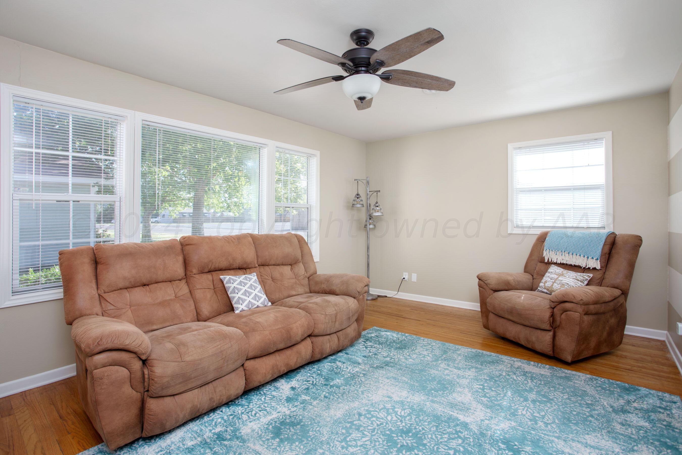 4406 South Bonham Street Amarillo, TX 79110 - Photo 5 of 26 a living room with furniture and a large window