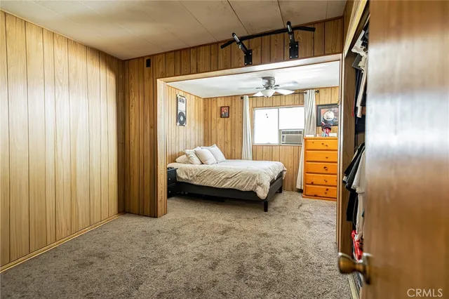 a bedroom with furniture and a shower