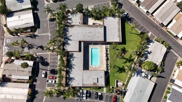 an aerial view of houses with outdoor space