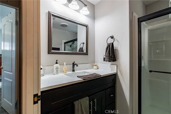 a bathroom with a double vanity sink and a mirror