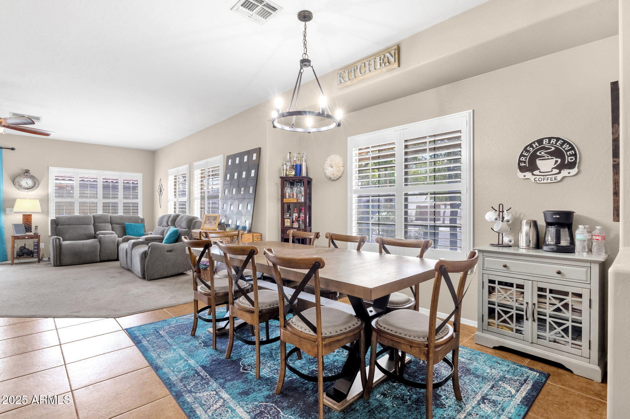 6456 South Nash Way Chandler, AZ 85249 - Photo 12 of 57 a view of a livingroom and dining room