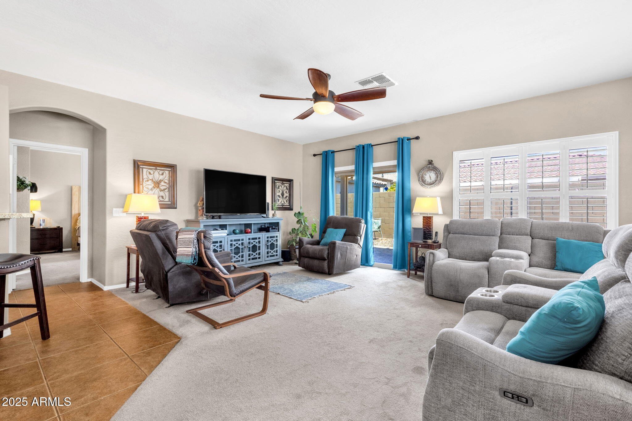 6456 South Nash Way Chandler, AZ 85249 - Photo 18 of 57 a living room with furniture and a flat screen tv