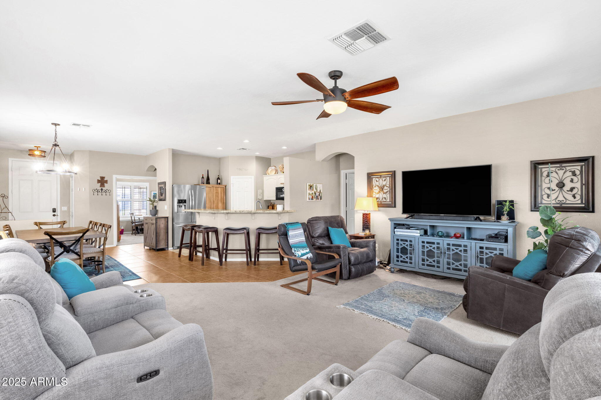 6456 South Nash Way Chandler, AZ 85249 - Photo 20 of 57 a living room with furniture and a flat screen tv