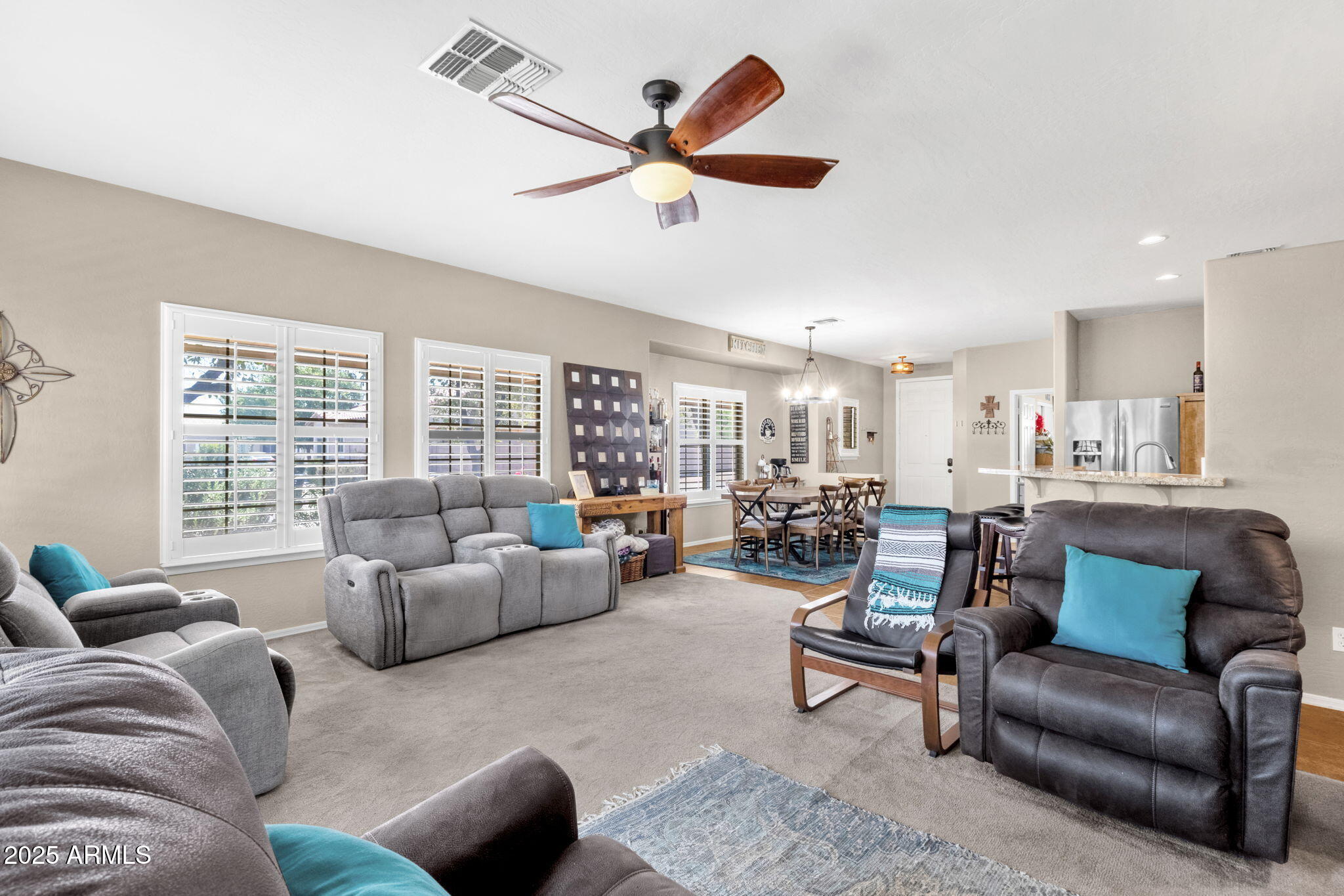 6456 South Nash Way Chandler, AZ 85249 - Photo 21 of 57 a living room with furniture and a large window