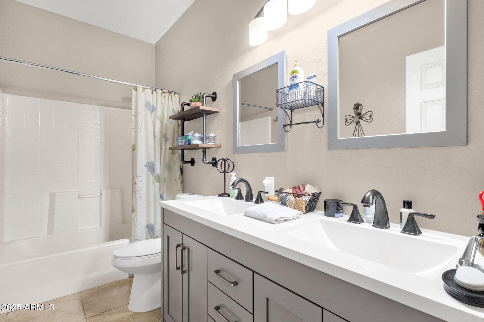 6456 South Nash Way Chandler, AZ 85249 - Photo 27 of 57 a bathroom with a sink a toilet and a large mirror