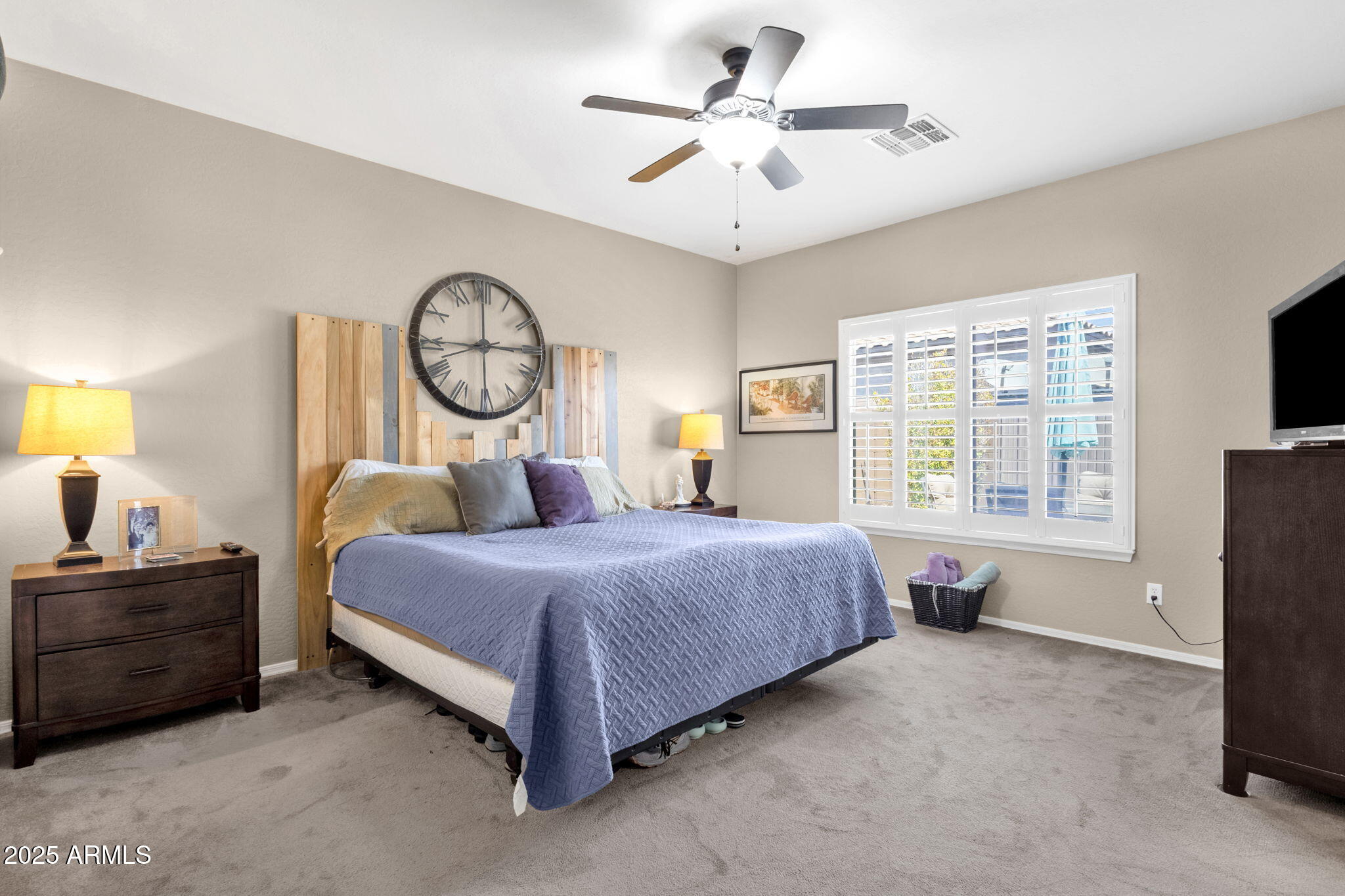 6456 South Nash Way Chandler, AZ 85249 - Photo 28 of 57 a bedroom with a bed dresser and a flat tv screen