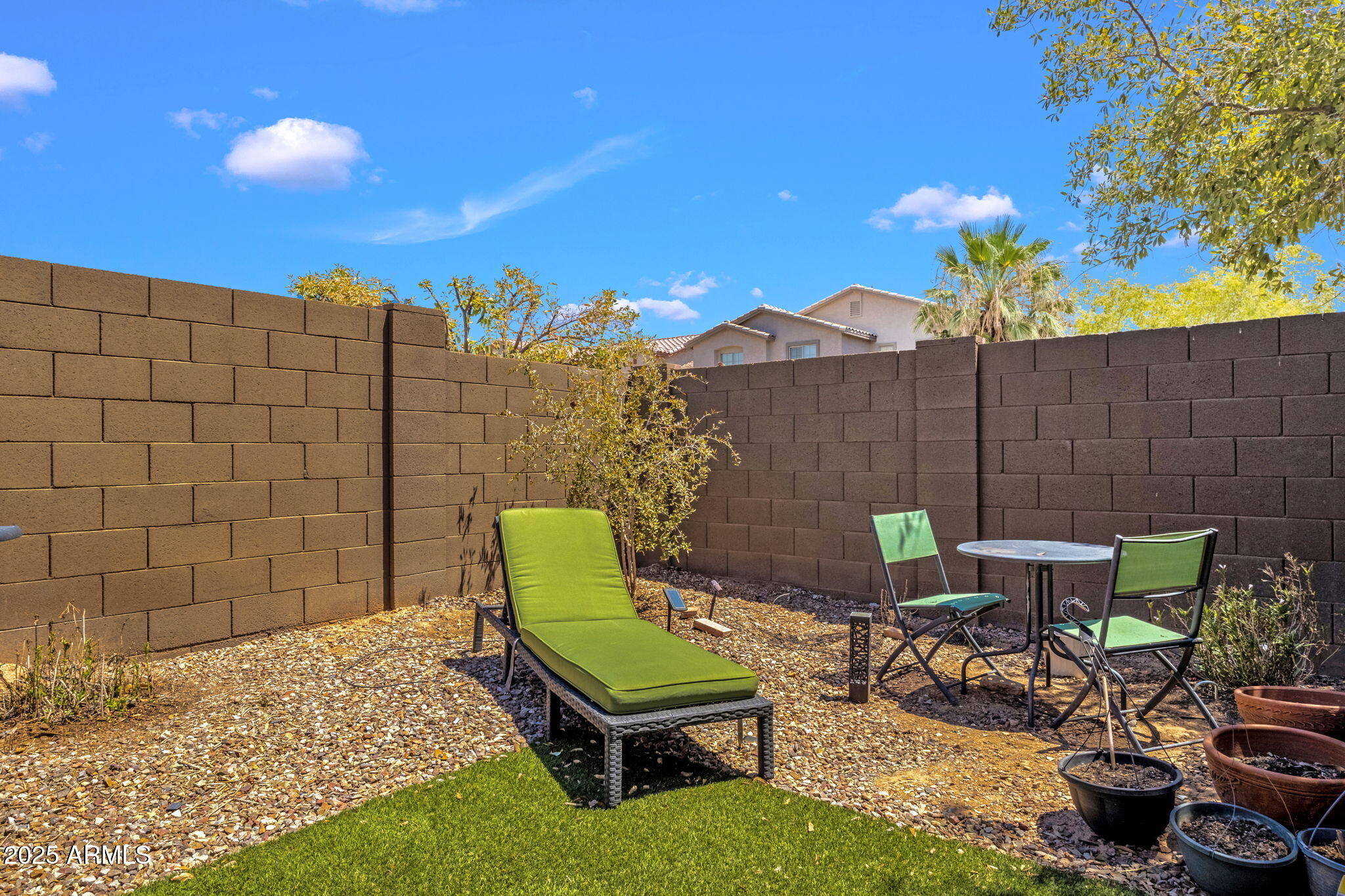 6456 South Nash Way Chandler, AZ 85249 - Photo 34 of 57 a backyard of a house with table and chairs