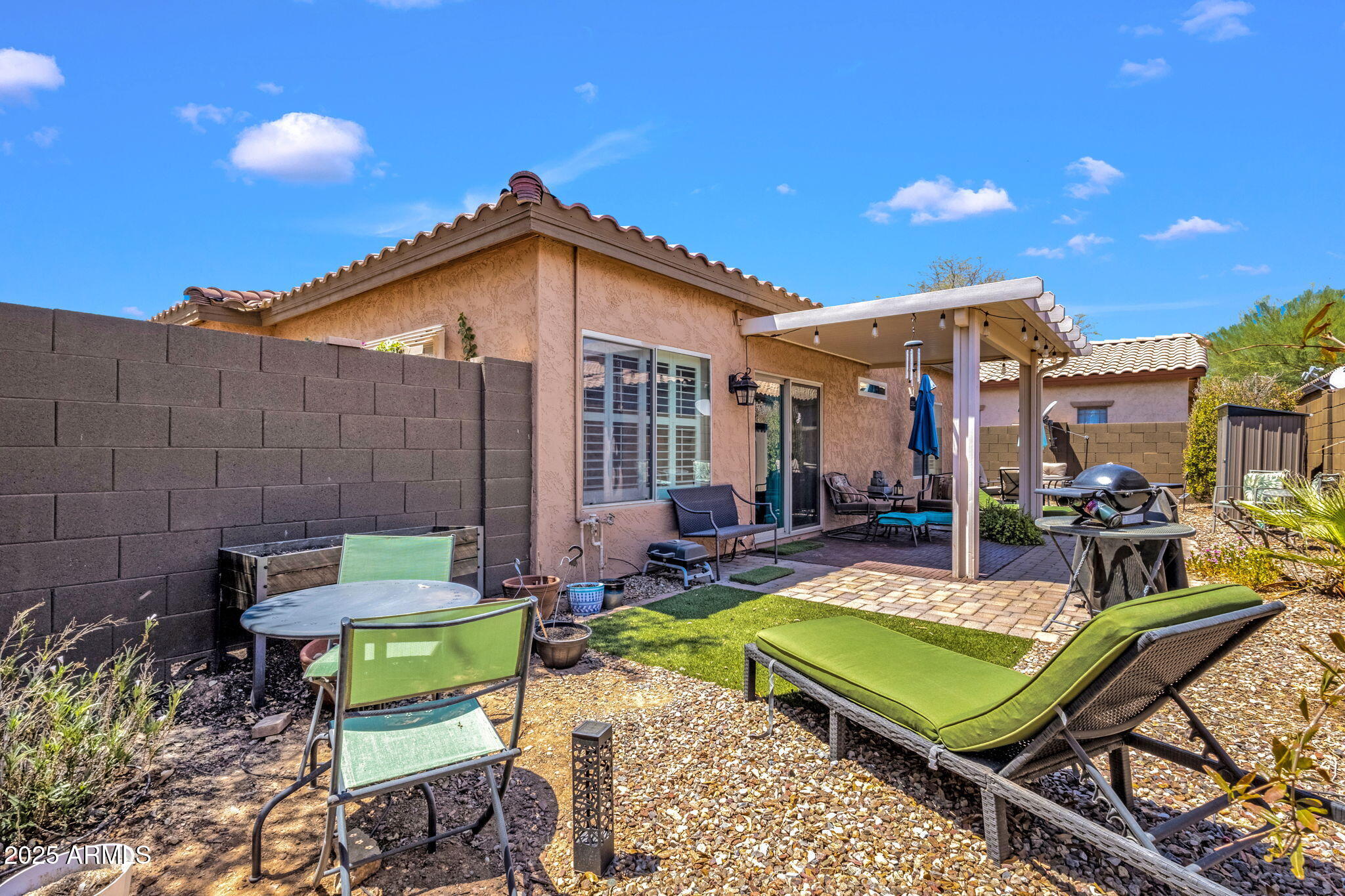 6456 South Nash Way Chandler, AZ 85249 - Photo 36 of 57 a backyard of a house with outdoor seating