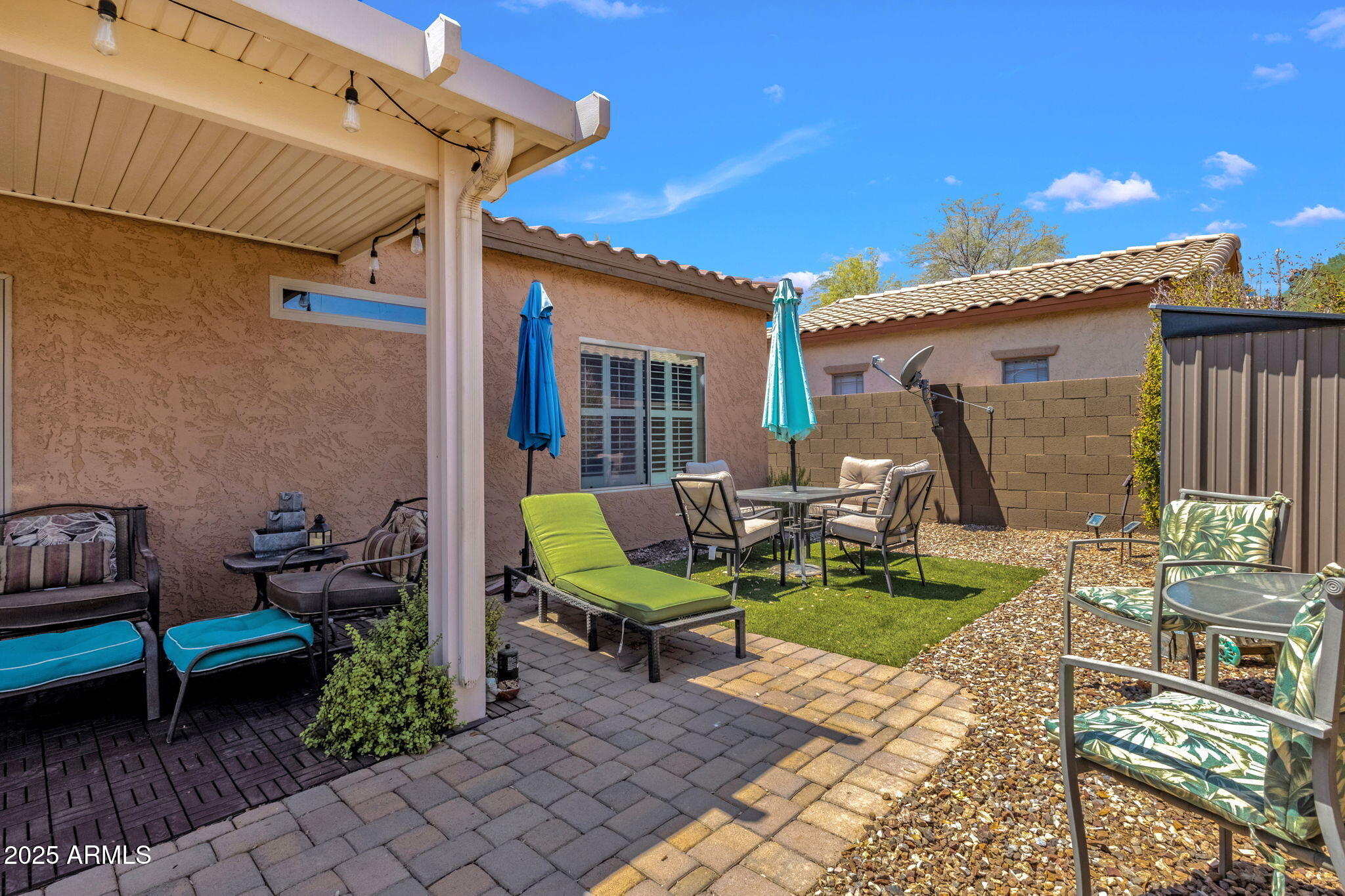 6456 South Nash Way Chandler, AZ 85249 - Photo 38 of 57 a view of a house with backyard sitting area and garden